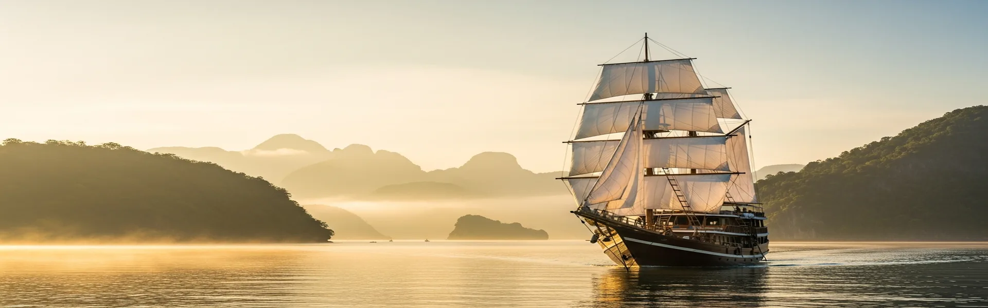 Traditional phinisi cruising through Komodo archipelago on a 3-day voyage